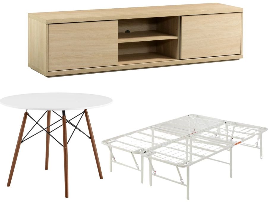 A tv stand, small round dining room table and a white metal bed frame 