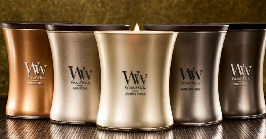 Five different warwick candles on top of the table 