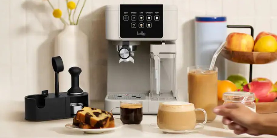 tan and black coffee maker on counter with drinks 