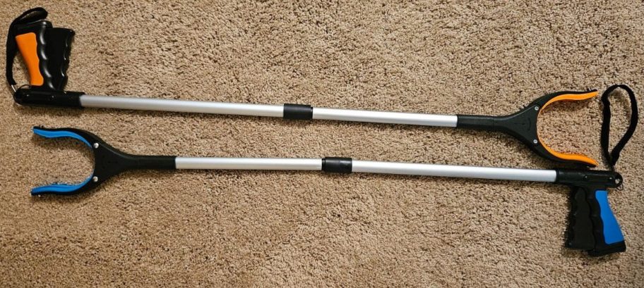 two foldable grabbers on carpet