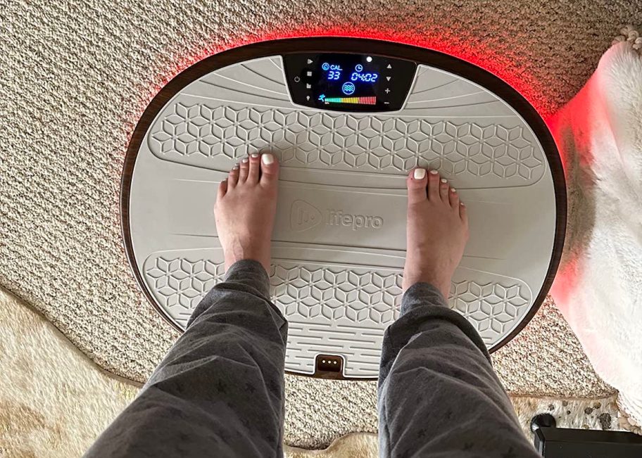 person standing on lifepro vibration plate 