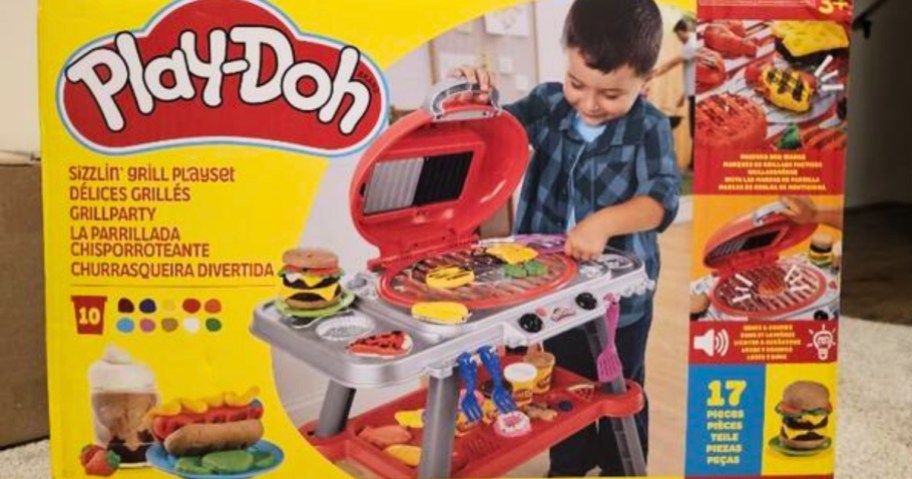a box with a Play-Doh Sizzlin' Grill playset