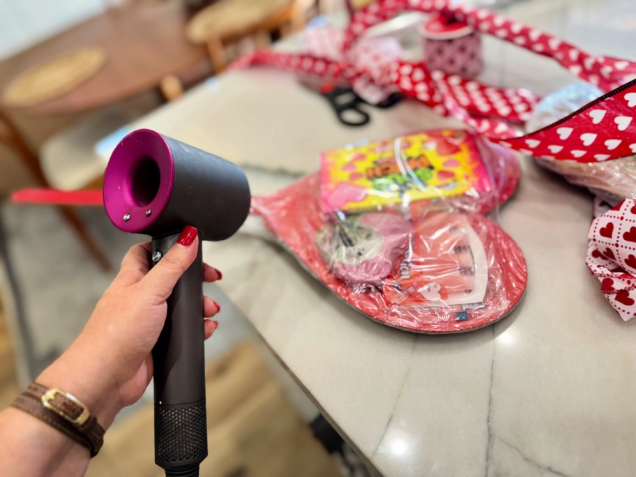 using a hair dryer to make a dollar tree gift basket