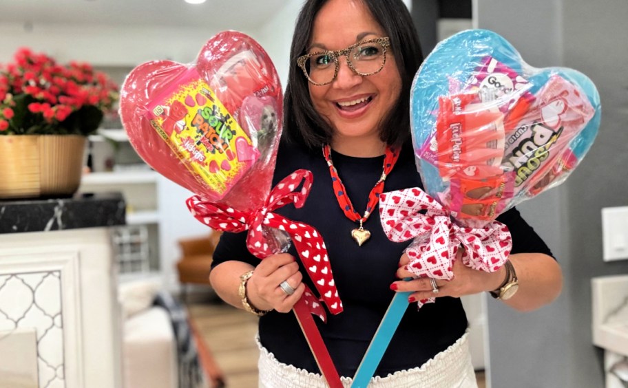 woman holding heart stake gifts from dollar tree