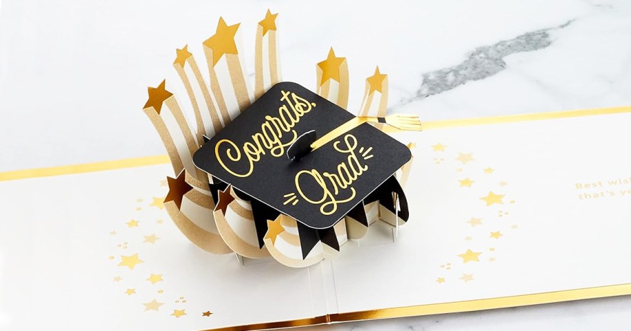 grad cap pop-up card that says congrats grad