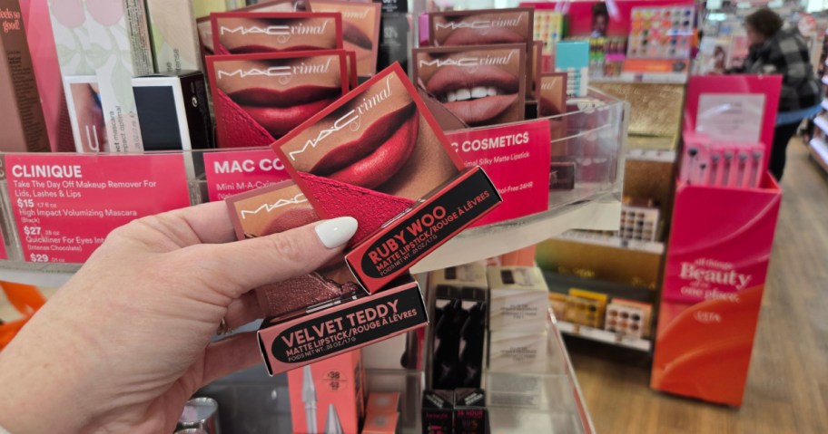 MAC lipsticks in hand