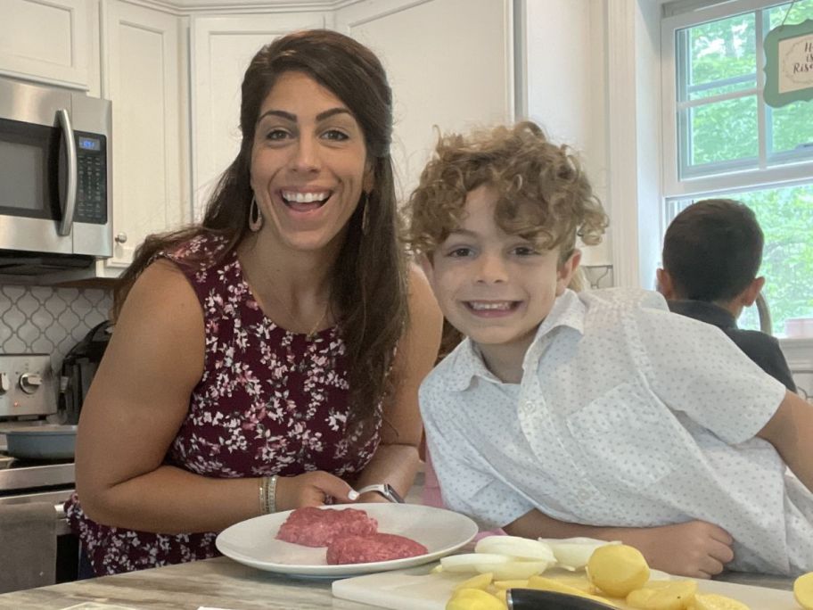 Woman prepping food with a boy