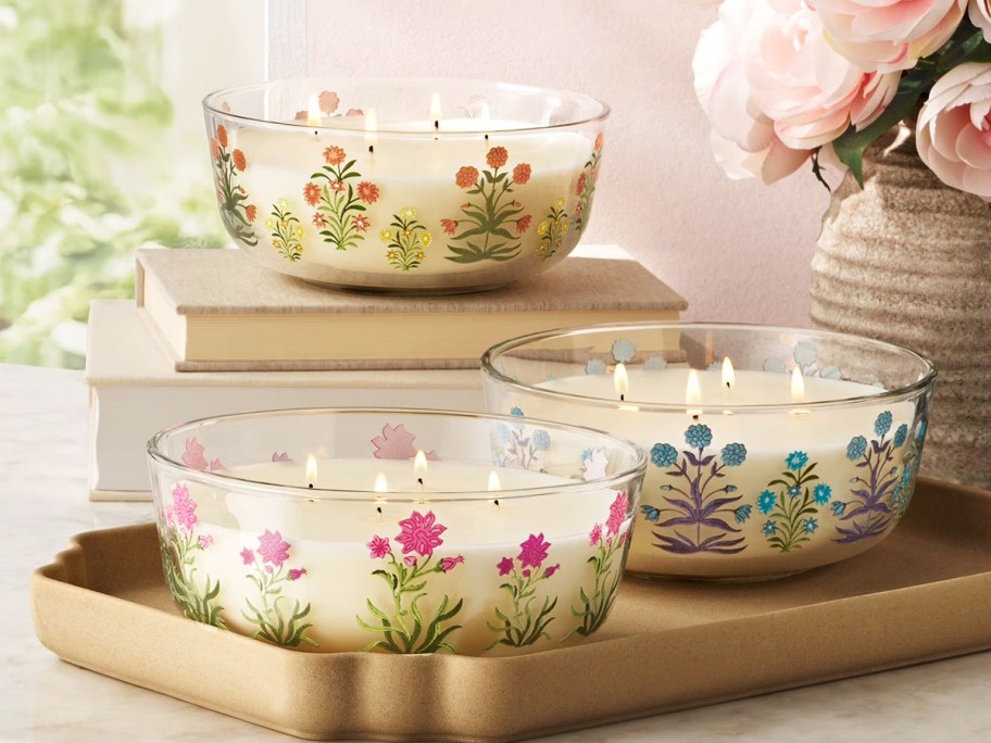 4-wick candles with floral design on them