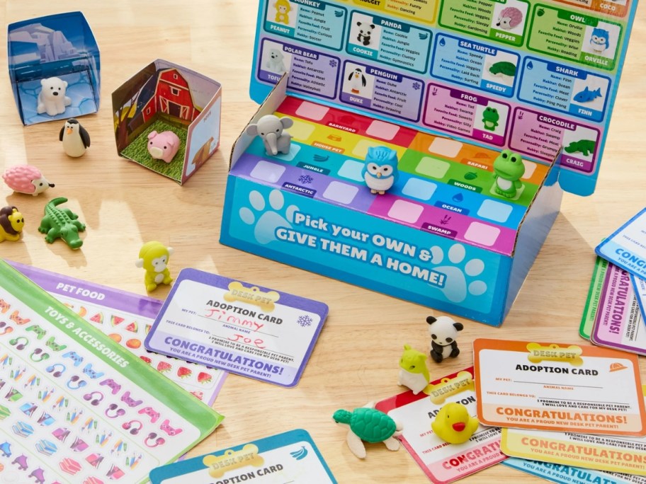a kids reward system with cards, mini animals and a box 