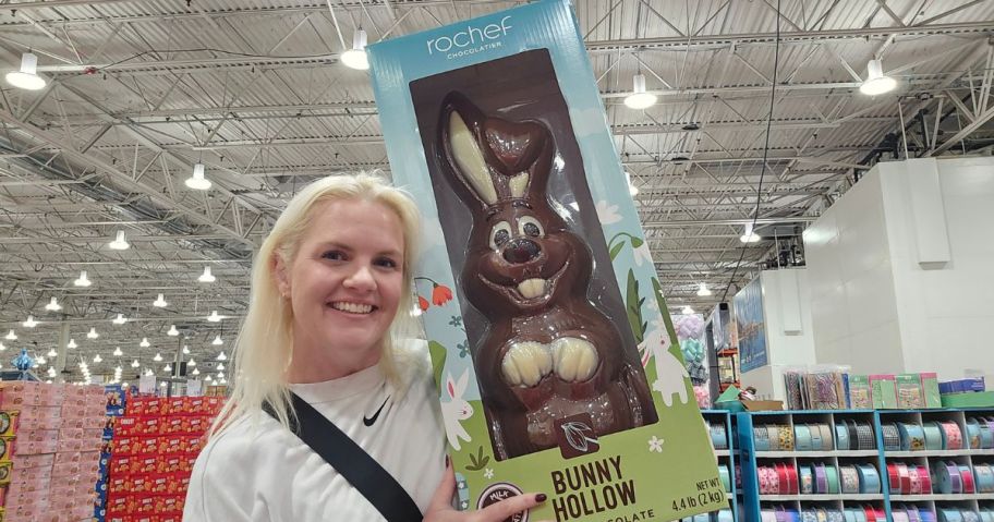 stefanie holding Rochef Chocolatier Large 70.4oz Easter Bunny in store