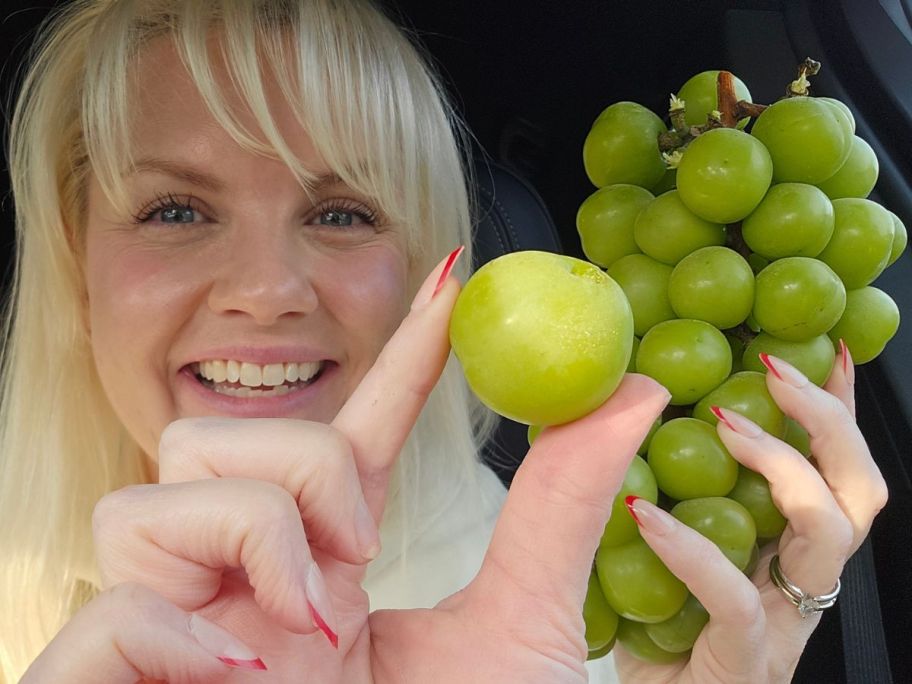 stefanie holding huge Shine Muscat Grape