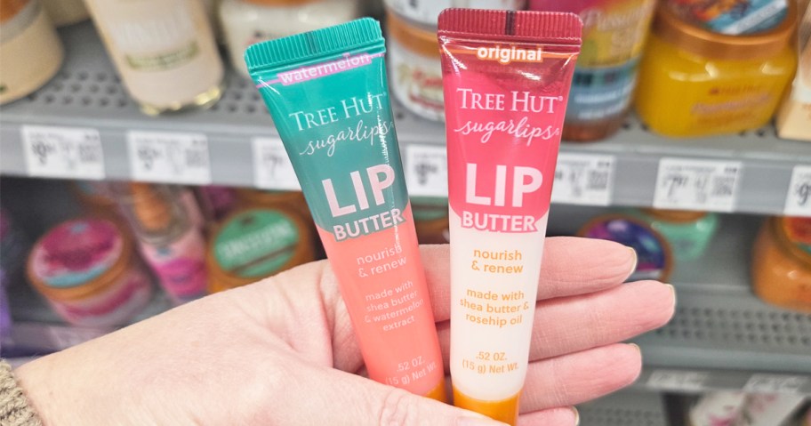 hand holding two tree hut lip butter tubes