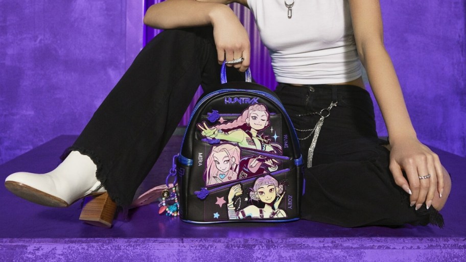a woman with a mini backpack
