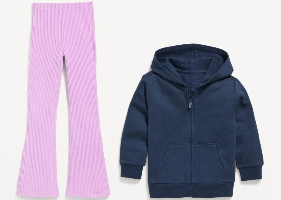 A navy blue zip-up hoodie with a hood and pockets is paired with light purple ribbed flare pants.