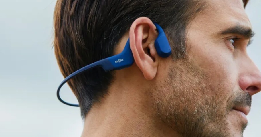 man wearing a pair of SHOKZ earbuds