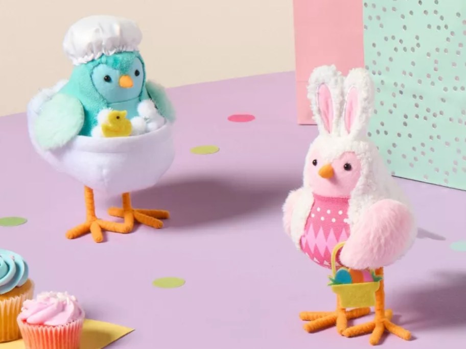 decorative Easter bird figures, one has a bathtub and the other is dressed like the Easter Bunny