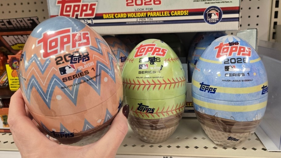womans hand reaching for an easter egg
