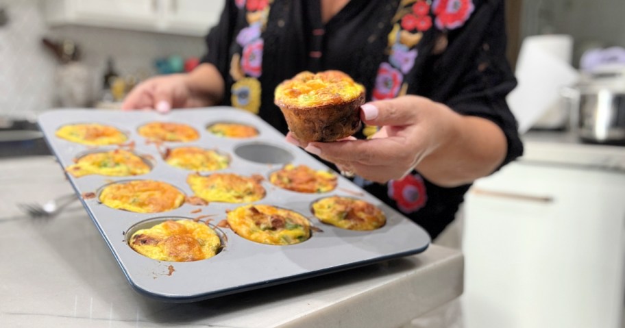 woman holding a crispy potato egg cup