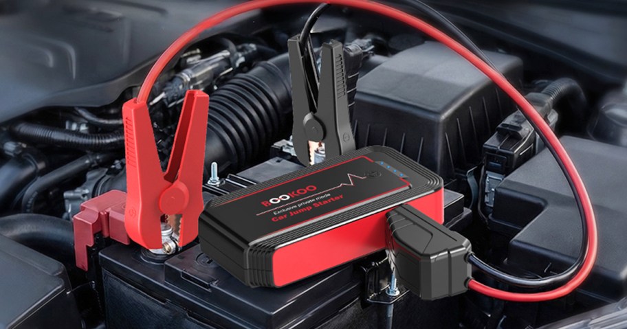 black and red car battery jump starter attached to mattery