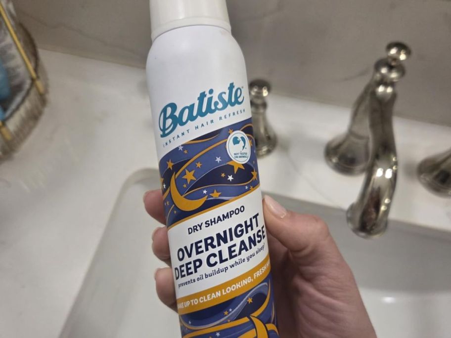 Batiste Overnight Deep Cleanse 3.81oz. Dry Shampoo in hand in bathroom