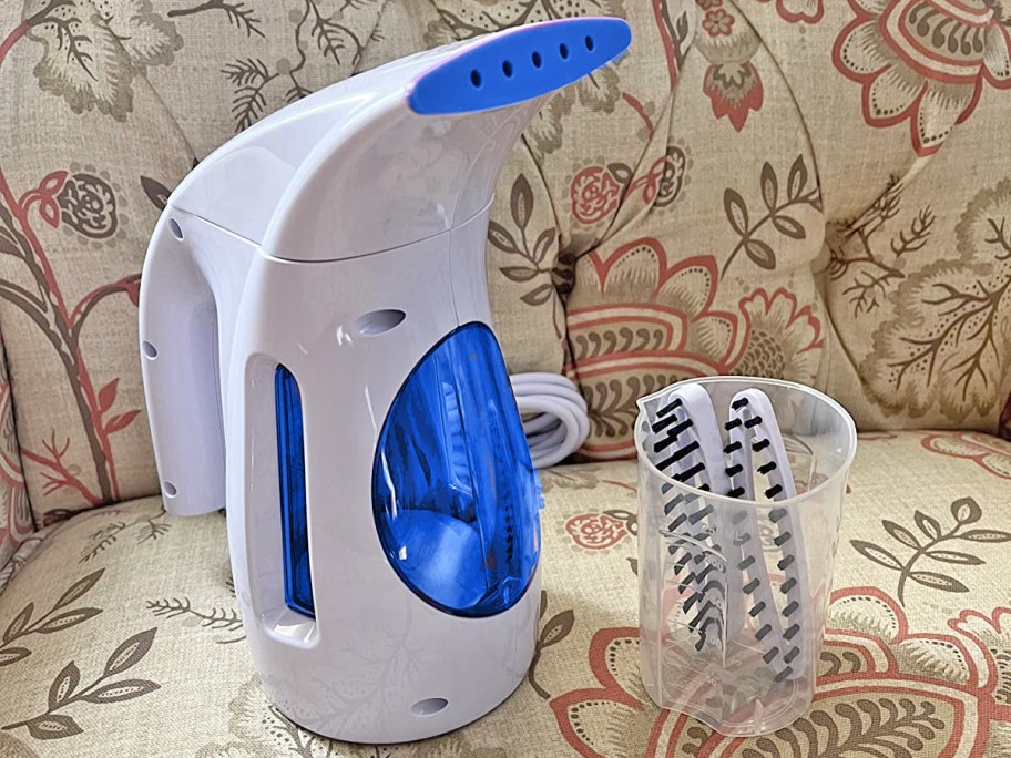 white and blue clothes steamer with attachments