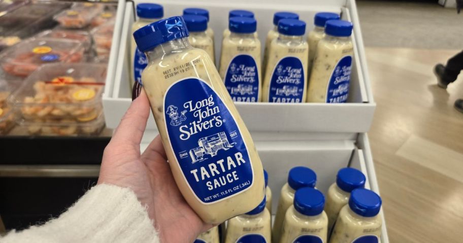 hand holding Long John Silver's Tartar Sauce bottle in store