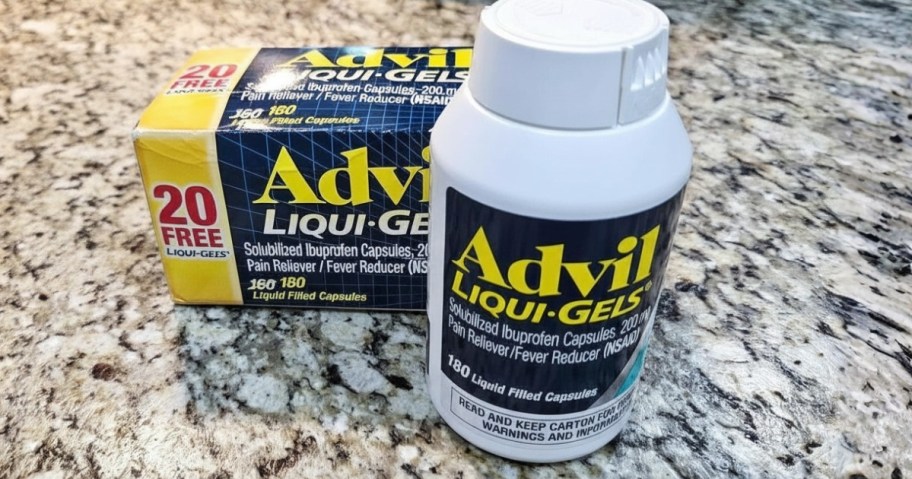 a bottle of Advil Liquid Gels next to the box it comes in on a counter
