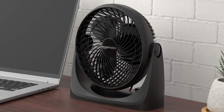 black fan sitting on desk 