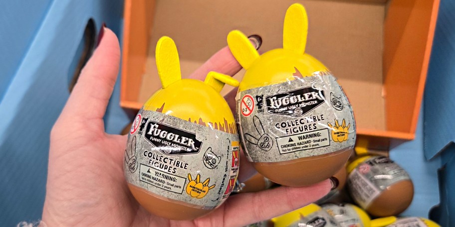 hand holding two fuggler easter eggs 