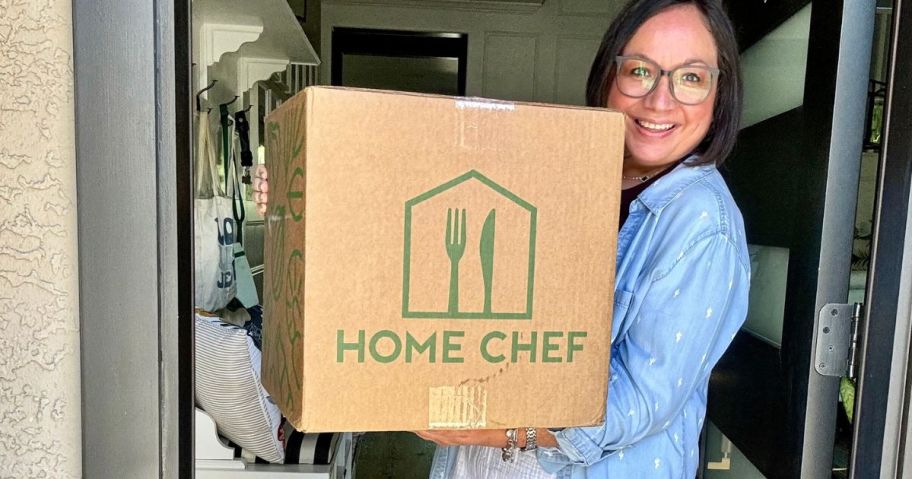 lina holding home chef box in doorway