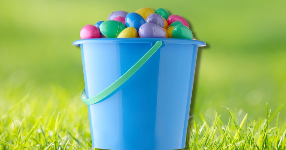 a large plastic pail with plastic Easter eggs in it