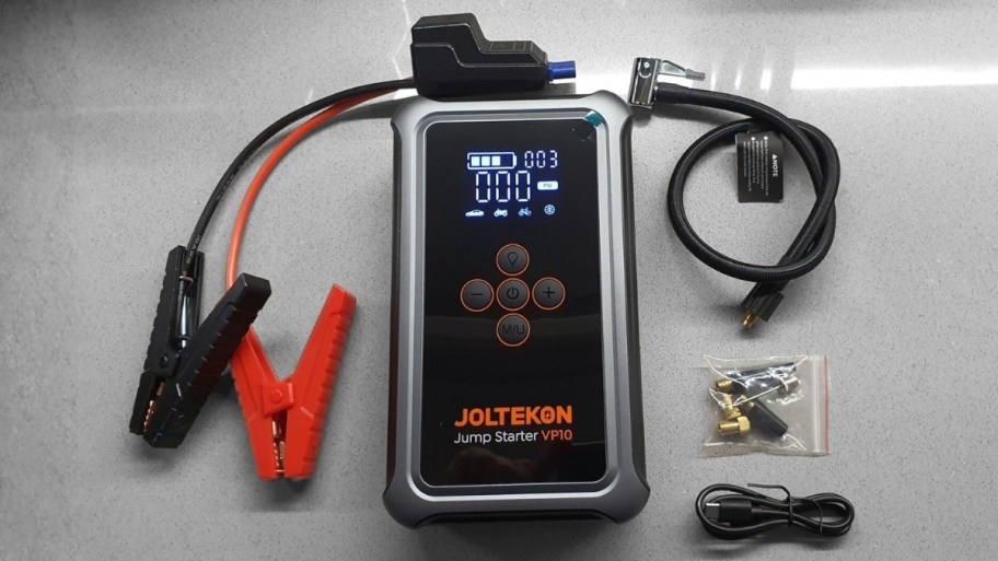 car jump starter and tire inflator shown with included accessories