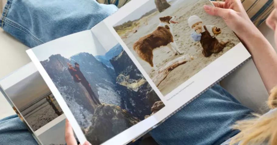 woman looking at shutterfly photo book