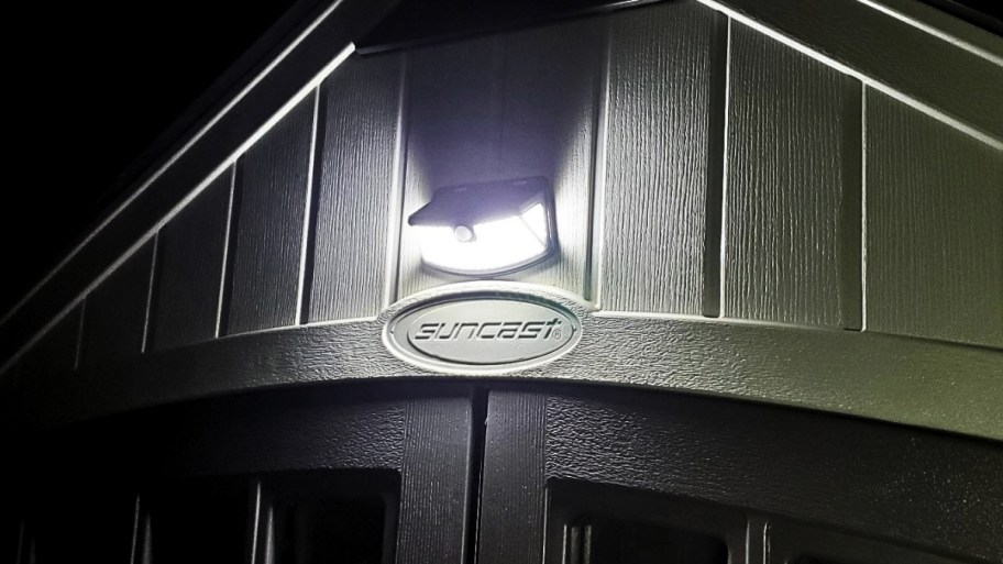 a solar spot light about a shed door