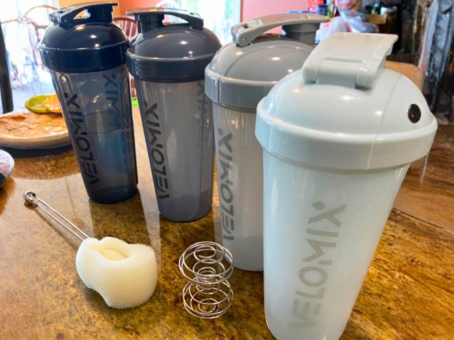 four protein shaker bottles