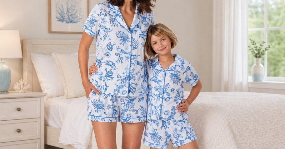 a mom and young daughter wearing matching blue floral pajamas