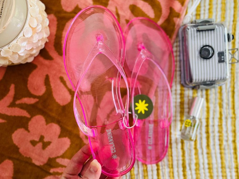 sara holding Anthropologie Celandine Jelly Flip Flops
