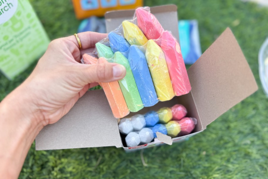 hand grabbing chalk out of box