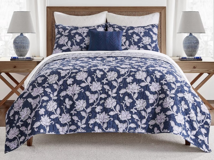 floral print quilt and shams on a bed