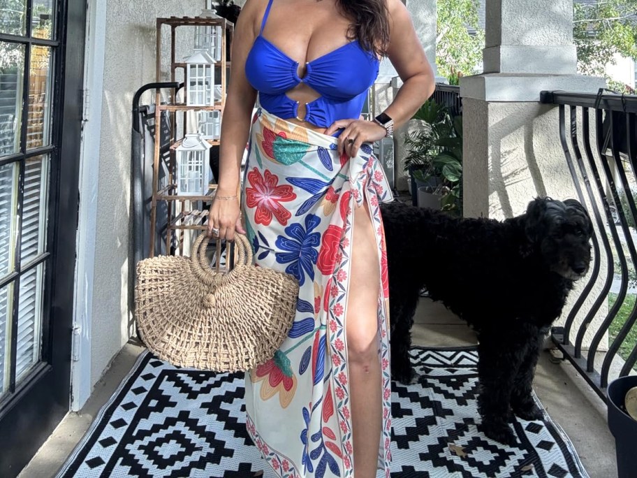 woman in a blue bathing suit with colorful sarong wrapped around her waist