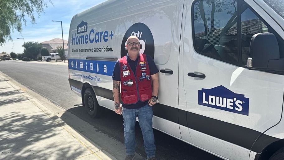 man standing outside with his home care lowes truck