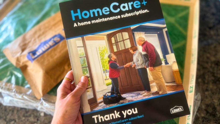 hand holding Home care+ lowes package