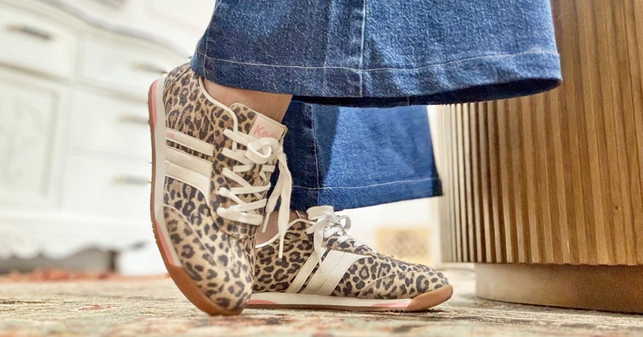 woman wearing a pair of leopard print sneakers