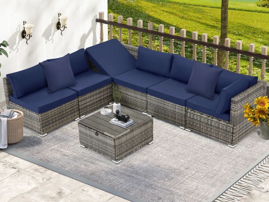 Latitude Run 7-Piece Sectional & Coffee Table Set on patio