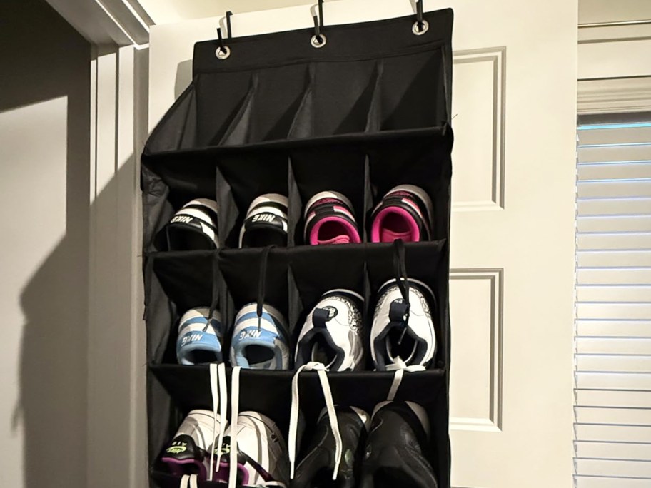 black over the door shoe organizer filled with sneakers