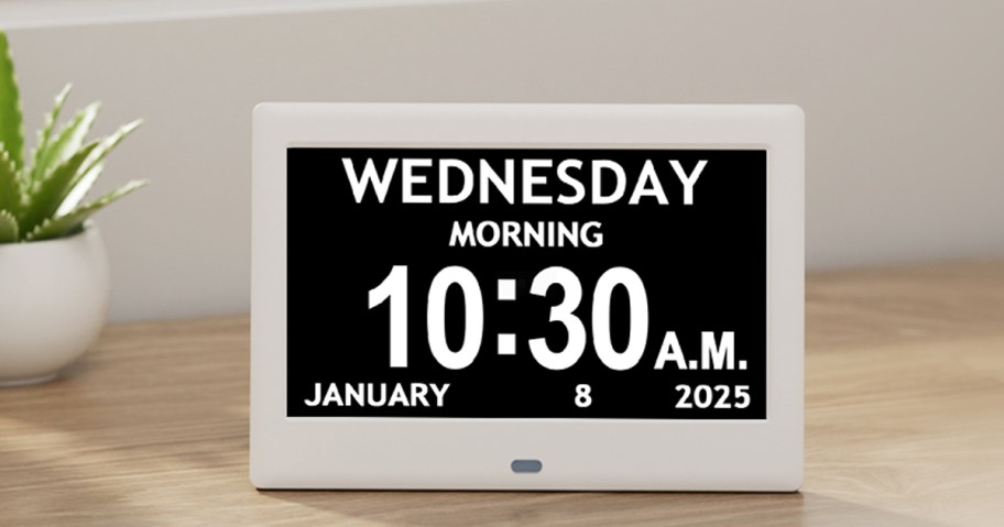 white and black digital clock on a table
