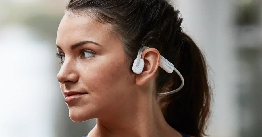 woman wearing a pair of white headphones