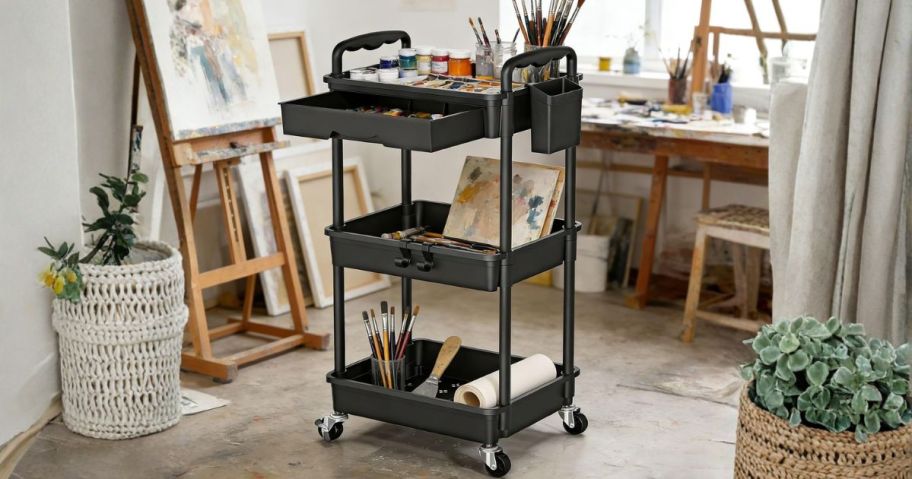 black rolling storage cart filled with art supplies