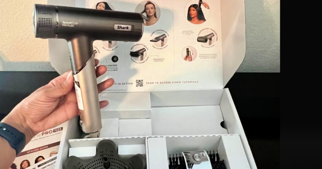 Hand holding a shark hairdryer