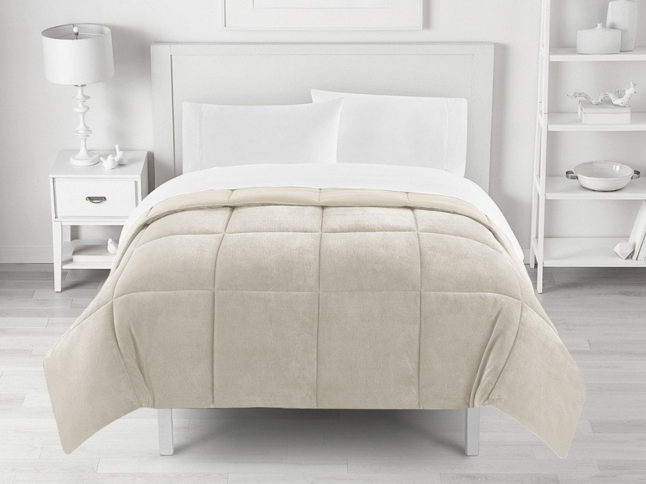 big one taupe comforter on a bed